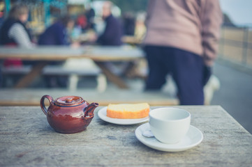 Tea and cake on table outside
