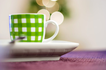 close up of a green striped coffee cup