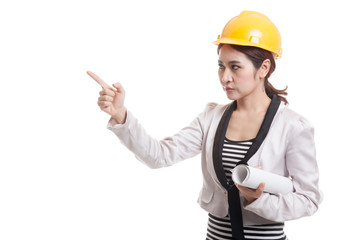 Asian engineer woman pointing with blueprints.