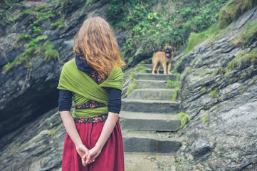 Woman walking dog in nature