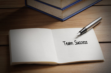 Team Success word on book