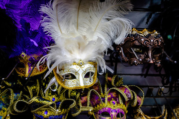 feathered white Mardi Gras mask on display at a souvenir shop in New Orleans, Louisiana