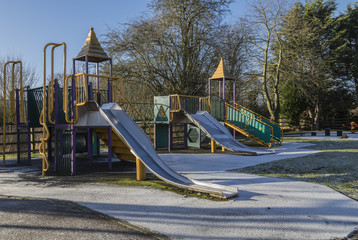Frosty Playground / An image of a colorful children's playground on a cold frosty morning in the UK