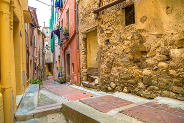 Fototapeta na wymiar Old narrow street in Menton, France