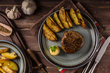 Steak with pepper sauce and mushrooms