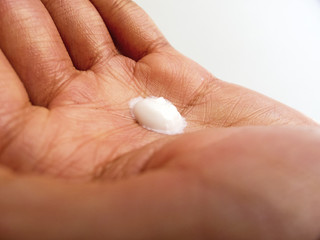 Closeup of female palm with lotion