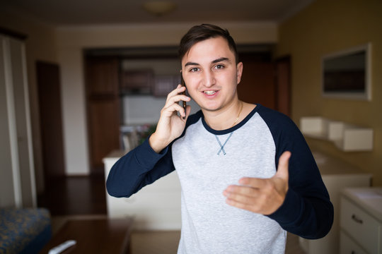 Portrait of cheerful man talking on the phone