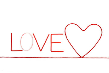Ribbons shaped as text love on white, valentines day concept