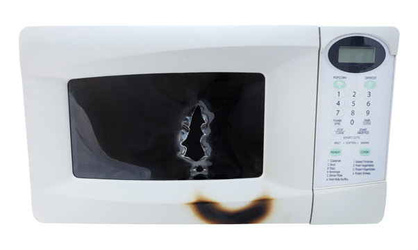 Microwave Oven With Fire And Explosion Damage. Isolated. Horizontal.