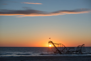 Sunrise behind Star Jet Roller Coaster after Hurricane Sandy 