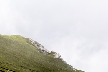 Landscape from Bucegi Mountains, part of Southern Carpathians in Romania in a very foggy day
