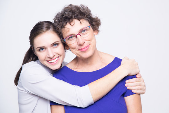 Loving daughter hugging beautiful mother