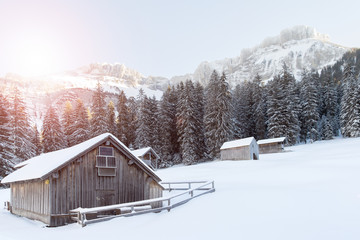 Fototapeta na wymiar wooden house in snow covered mountains