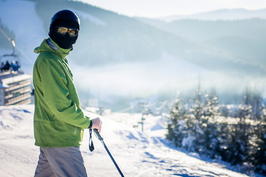 Young man is skiing in mountains