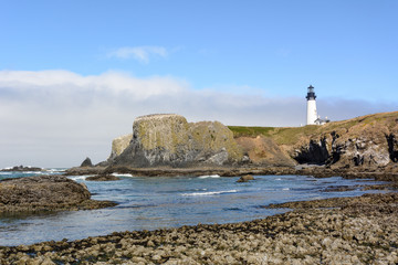 Fototapeta na wymiar Yaquina Head Lighthouse at the Oregon Coast