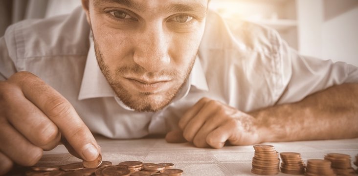 Desperate Businessman Counting His Change