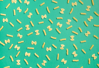 Farfalle and fusilli pasta flat lay pattern