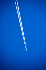 Plane trails on the blue sky