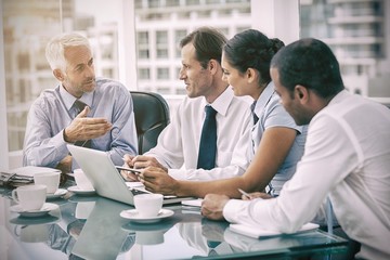 Group of business people brainstorming together