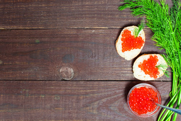 sandwiches with heart shaped red caviar and herbs