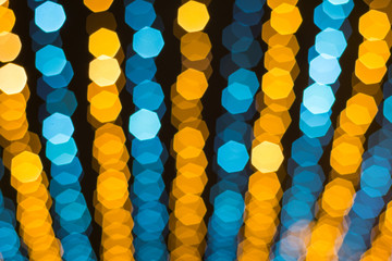 Abstract blur colorful blue and yellow bokeh background texture.