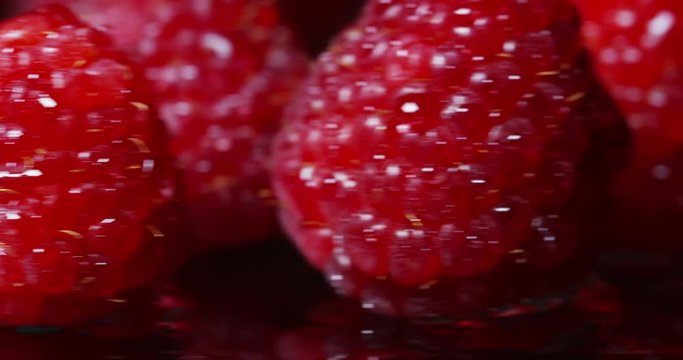 Extreme macro of juicy raspberries and genuine. Fresh red fruits and rich antioxidant vitamins. organic raspberries fruits, concept of vegan and vegetarian.