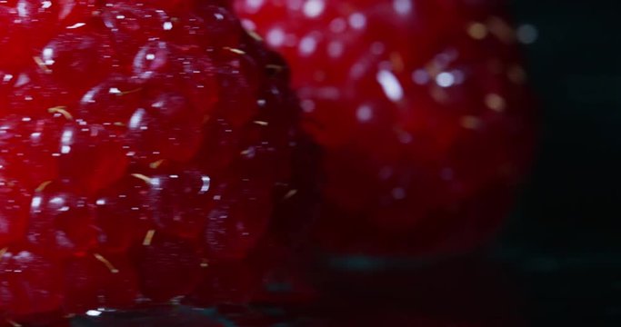Extreme macro of juicy raspberries and genuine. Fresh red fruits and rich antioxidant vitamins. organic raspberries fruits, concept of vegan and vegetarian.