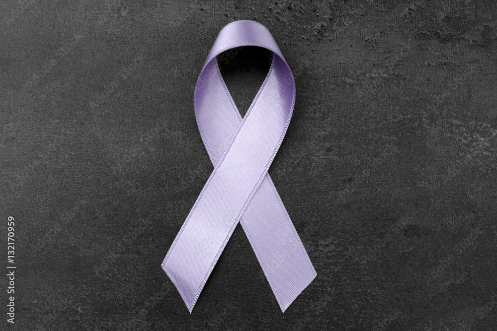 Wall mural Lavender ribbon on dark background. Cancer and epilepsy concept