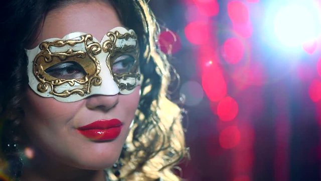 Closeup of sexy woman wearing venetian masquerade mask at party 1080p, slow motion 240 fps, high speed camera shot