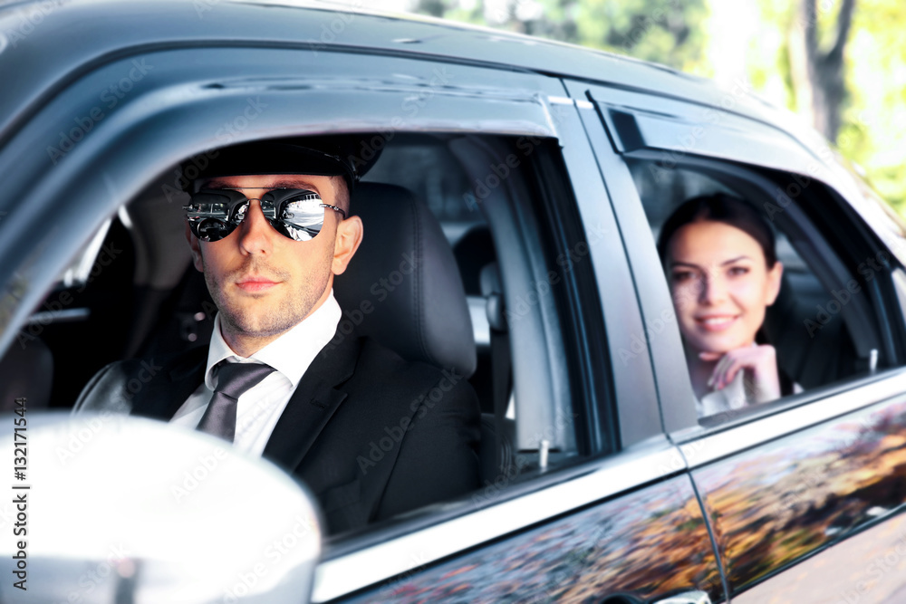 Canvas Prints Businesswoman riding a car with chauffeur