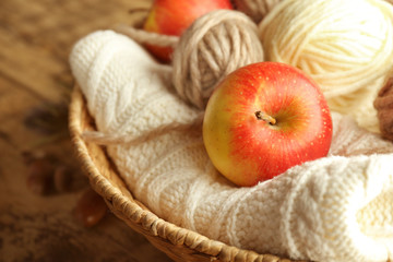 Apple and knitting yarn, closeup