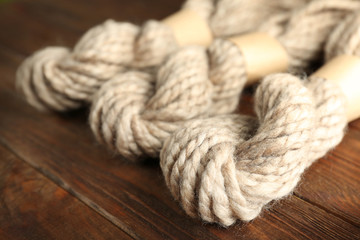 Knitting yarn on wooden background