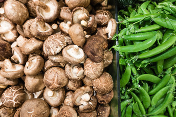 Raw mushroom and green pea in supermarket