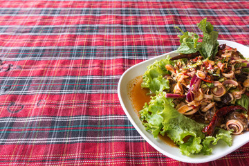 Authentic thai cockle yum salad taken outdoor with natural light