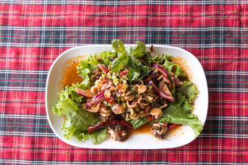 Authentic thai cockle yum salad taken outdoor with natural light