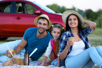 Happy family on picnic outdoors