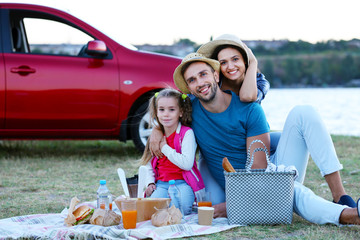 Happy family on picnic outdoors