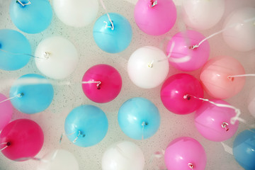 Colorful balloons in room prepared for birthday party, bottom view