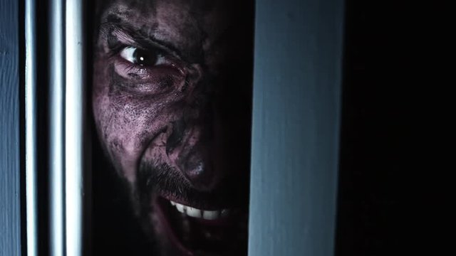 4K Horror Dirty Man Eye Looking in Door Gap and Shouting