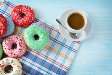 Composition with delicious donuts and cup of coffee