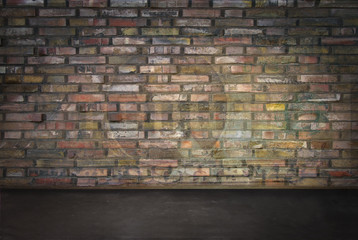 room with brick wall and dark floor
