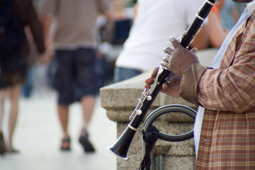 Hamburg, Germany – 31. July 2009: male street musician playing clarinet