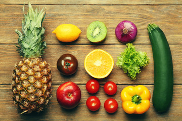 Colourful fruits and vegetables on wooden background