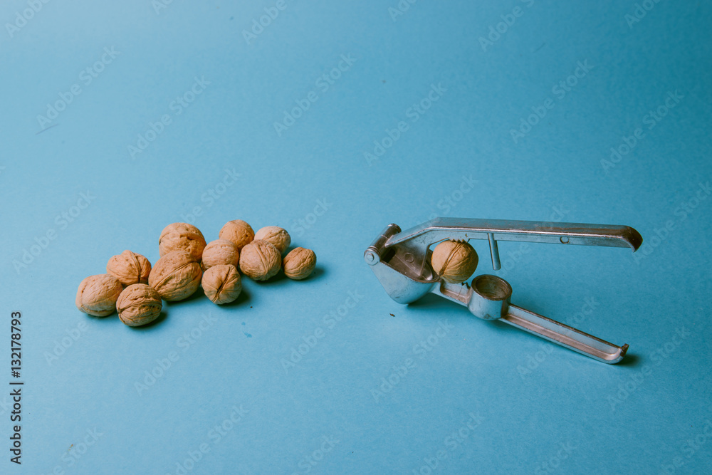 Wall mural Walnuts and nutcracker