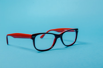 pair of red plastic-rimmed eyeglasses