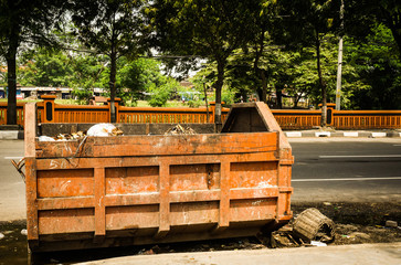 Abandoned garbage truck on the road side photo taken in Semarang Indonesia