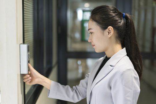 Woman scaning finger print for enter security system