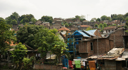 Fototapeta premium Slums on top of a hill with bush photo taken in Semarang indonesia