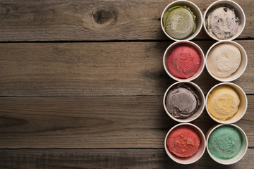 Top view Ice cream flavors in cup on blackground
