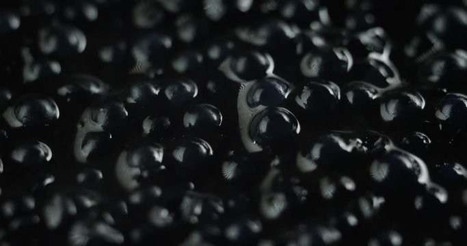 Macro shot of caviar, is a food that is achieved through processing and salting the eggs of several species of sturgeon. Food concept, high-quality, gourmet, restaurants.